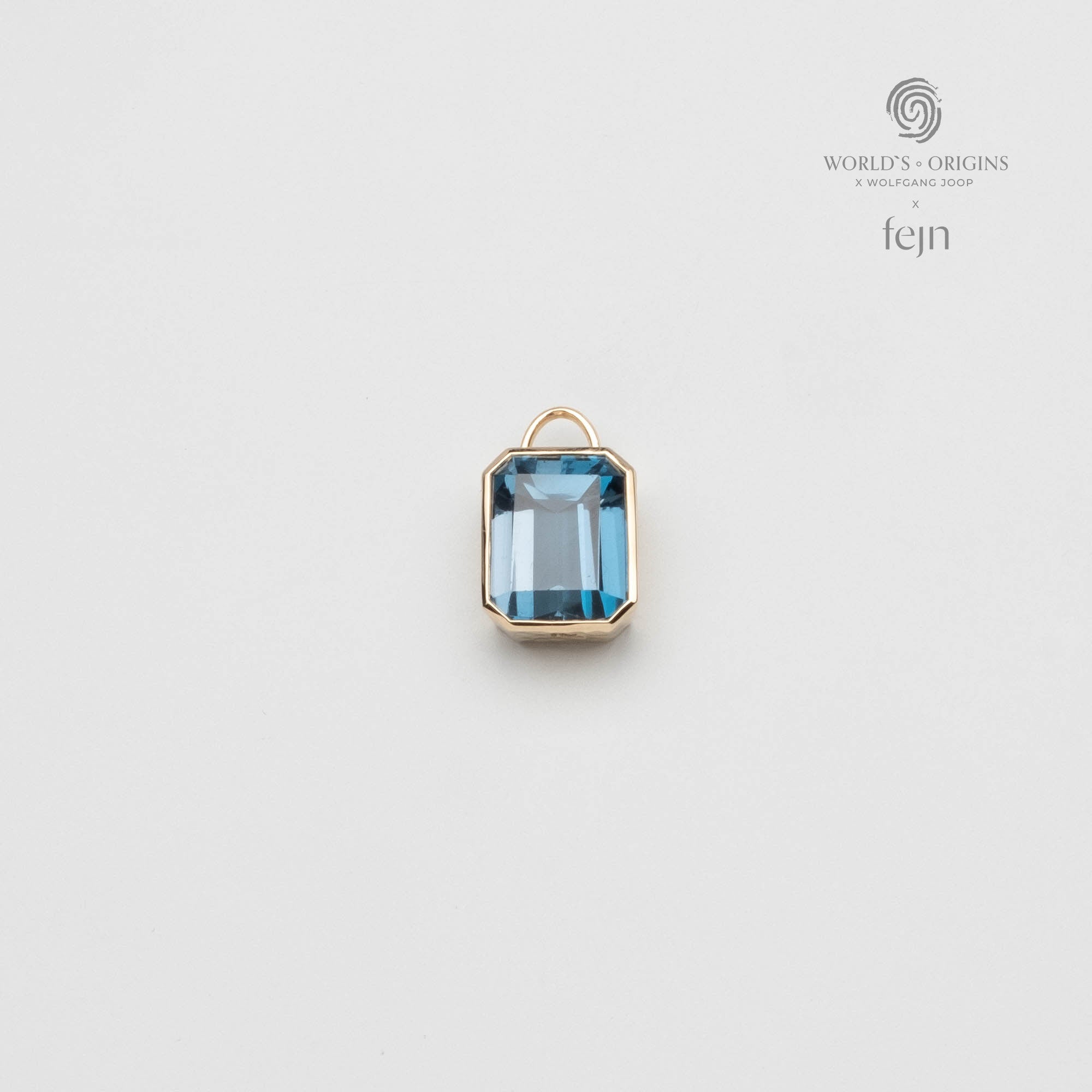 Hammered necklace charm solid gold blue topaz worlds origins wolfgang joop