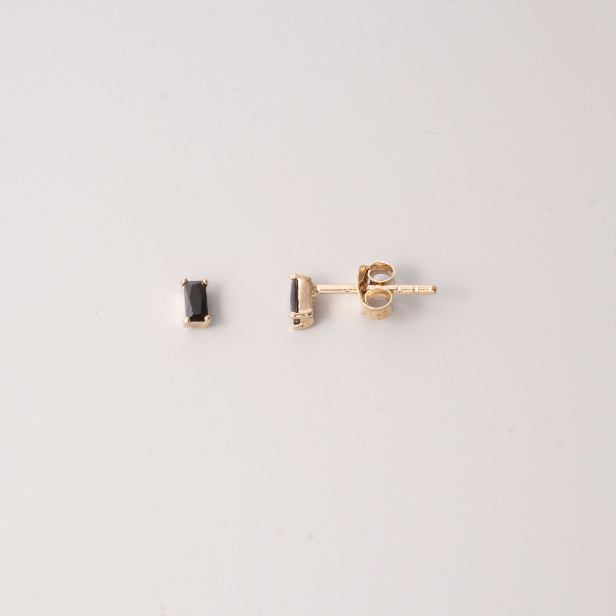 black baguette studs gold